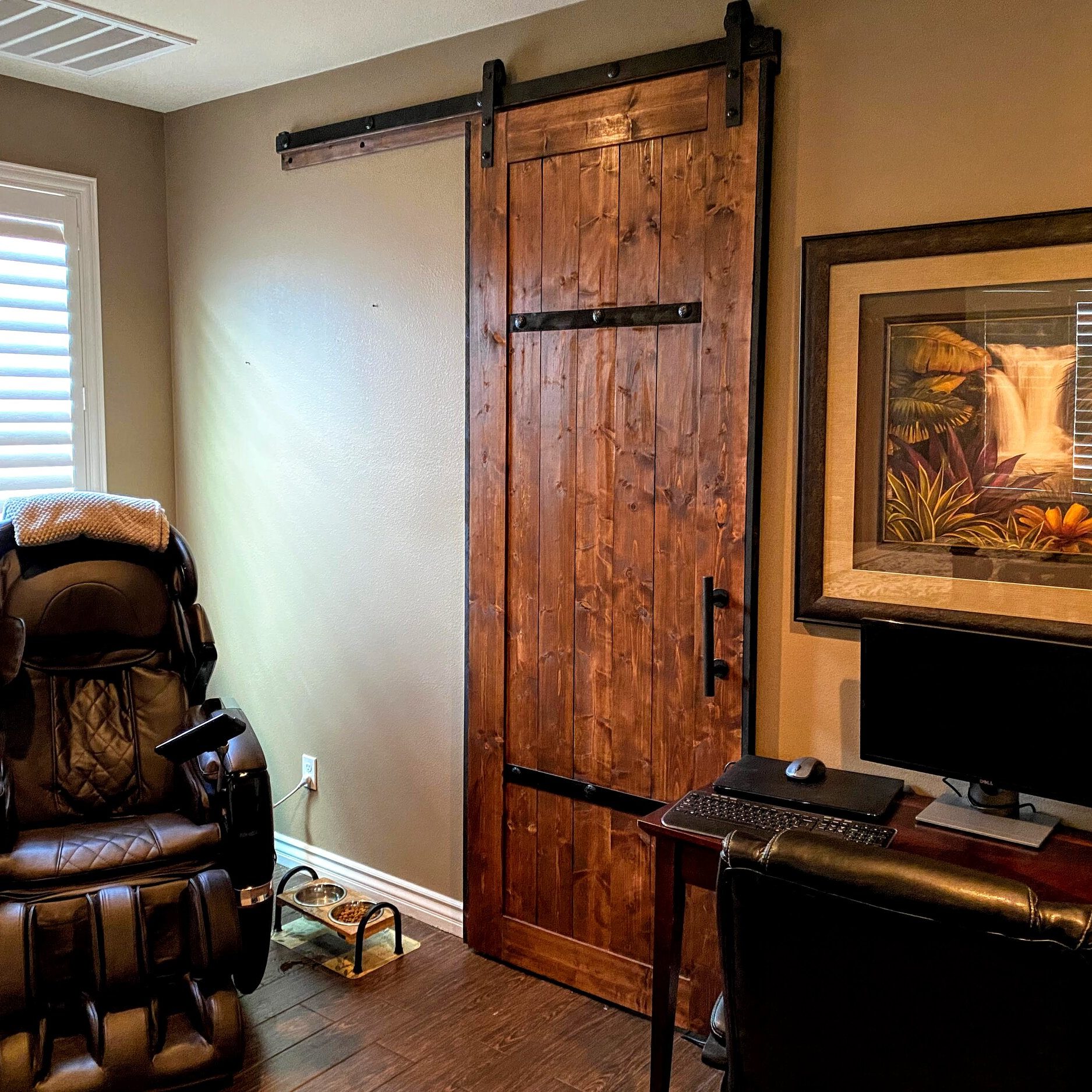 Man cave office sliding door. Rustic distressed with metal bars and clavos, custom made to opening and stained to match his space